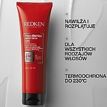 Wygładzający krem termoochronny przeciw puszeniu się włosów - Redken Frizz Dismiss Rebel Tame — Zdjęcie N2