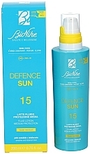 Balsam do ciała z filtrem przeciwsłonecznym - BioNike Defence Sun SPF15 Fluid Lotion Water Resistant — Zdjęcie N2