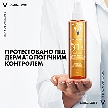 Wodoodporny olejek przeciwsłoneczny do twarzy, ciała i włosów SPF 50+ - Vichy Capital Soleil Invisible Oil SPF 50+ — Zdjęcie N8