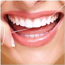 Woskowana nić dentystyczna Mięta, 50 m - Oral-B Essential Floss — Zdjęcie N4