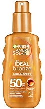 Kup Mleczko z filtrem przeciwsłonecznym - Garnier Ambre Solaire Ideal Bronze Milk-In-Spray SPF50