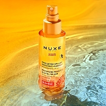PRZECENA! Dwufazowy ochronny olejek do włosów - Nuxe Sun * — Zdjęcie N3