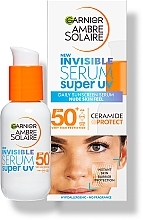 Serum do twarzy z filtrem przeciwsłonecznym - Garnier Ambre Solaire Invisible Serum Spf50 — Zdjęcie N2