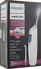 Urządzenie do czyszczenia przestrzeni międzyzębowych - Philips Sonicare AirFloss Ultra HX8438/01 — Zdjęcie N1