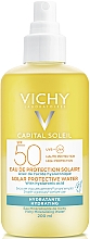 Dwufazowy spray nawilżający do twarzy i ciała z kwasem hialuronowym, SPF50 - Vichy Capital Soleil Solar Protective Water — Zdjęcie N1