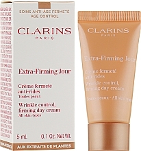 Ujędrniający krem na dzień do wszystkich typów cery - Clarins Extra-Firming Day Wrinkle Lifting Cream For All Skin Types (mini) — Zdjęcie N2