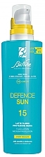 Kup Balsam do ciała z filtrem przeciwsłonecznym - BioNike Defence Sun SPF15 Fluid Lotion Water Resistant