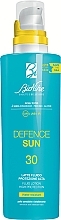 Balsam do ciała z filtrem przeciwsłonecznym - BioNike Defence Sun SPF30 Fluid Lotion Water Resistant — Zdjęcie N1