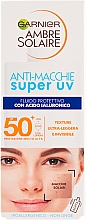 Kup Fluid do twarzy z filtrem przeciwsłonecznym - Garnier Ambre Solaire Anti-Dark Spots Protection Fluid SPF50