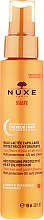Kup Nawilżający mleczny olejek ochronny do włosów - Nuxe Sun Milky After Sun Hair Oil