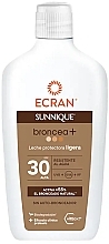 Mleczko do ciała z filtrem przeciwsłonecznym - Ecran Sunnique Broncea+ SPF30 — Zdjęcie N1