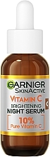 Serum na noc z witaminą C redukujące widoczność plam starczych, zmarszczek i wyrównujące koloryt skóry - Garnier Skin Active Vitamin C Night Serum — Zdjęcie N2