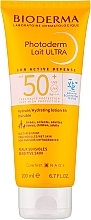 Kup Nawilżający balsam przeciwsłoneczny do twarzy i ciała SPF 50+ - Bioderma Photoderm Lait Ultra Moisturising Lotion Sensitive Skin SPF 50+