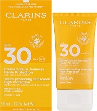 Przeciwzmarszczkowy krem przeciwsłoneczny - Clarins Youth-Protecting Sunscreen SPF 30 — Zdjęcie N2